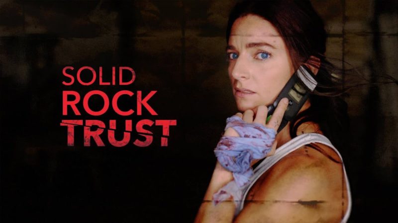 Revision de Solid Rock Trust Koko Marshall realiza un atraco